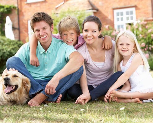 image of a family together in their front lawn for Personal-Injury-Claims-for-Children-sml by Mullins & Treacy LLP Solicitors Waterford