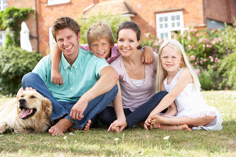 image of a family together in their front lawn for Personal-Injury-Claims-for-Children-sml by Mullins Treacy Solicitors Waterford